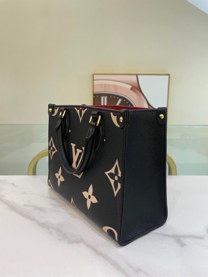 Pre-Loved Louis Vuitton On The Go PM Tote Bag Calfskin - ShopShops